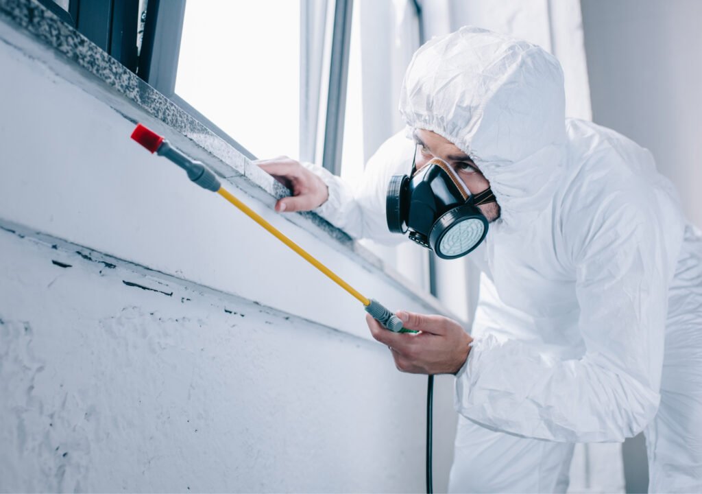 IPM Tech Pest Control Services Worker Servicing a house for Termites